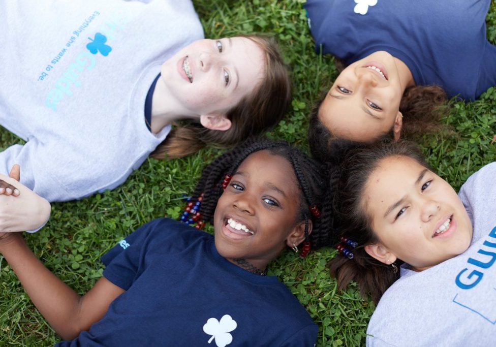 Guides-smiling-in-grass