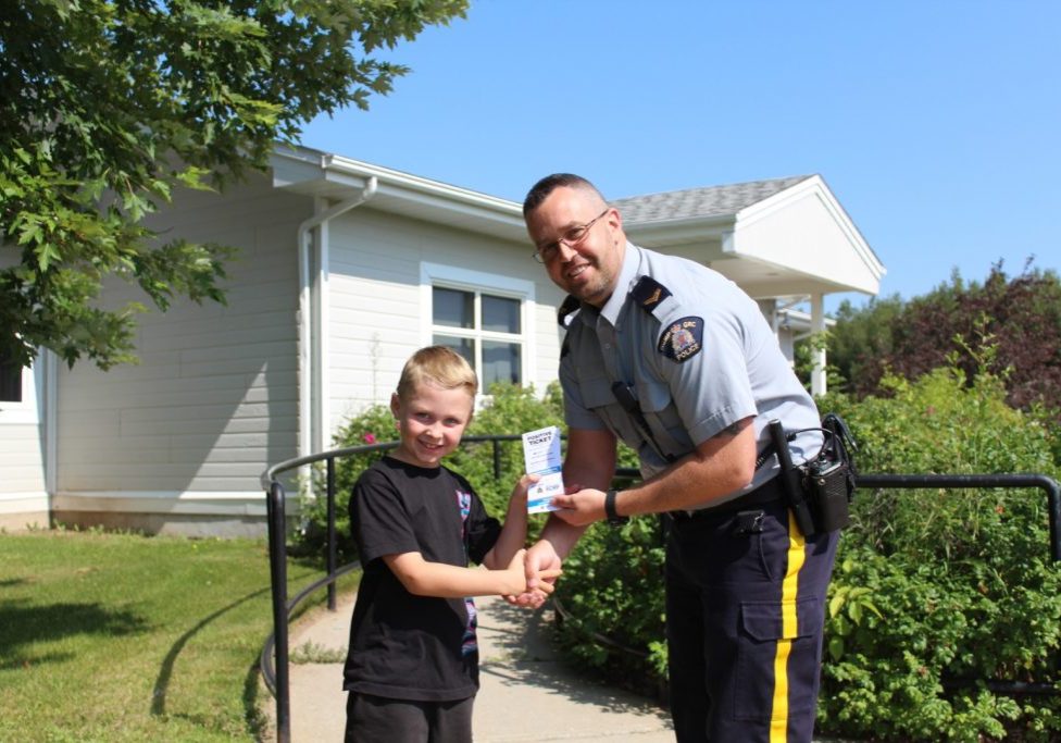 Hunter Linkletter receives a Positive Ticket from Cpl. Jason LeBlanc from Northeast District RCMP Blackville