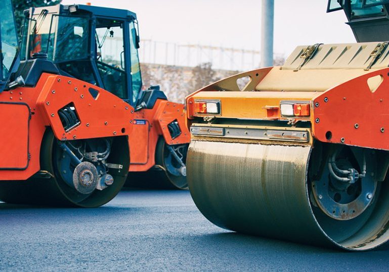 Close view on the road roller working on the new road construction site